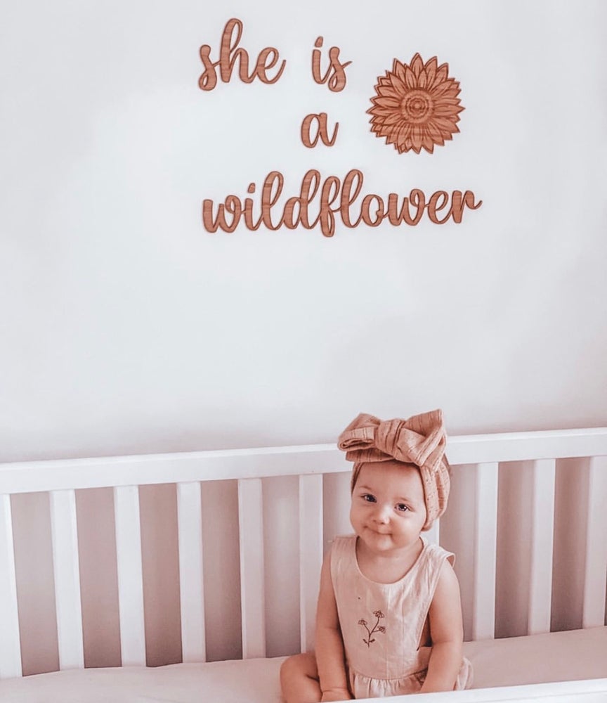 She is a wildflower wall plaque
