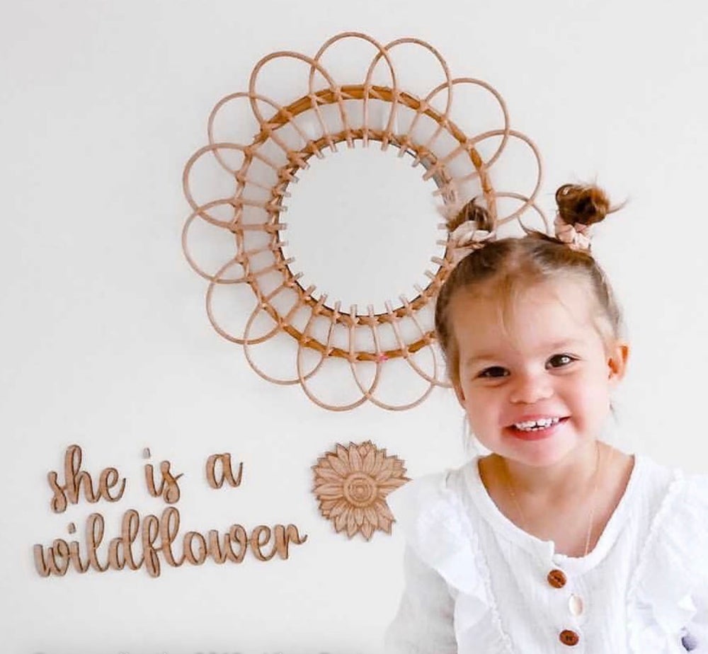 She is a wildflower wall plaque